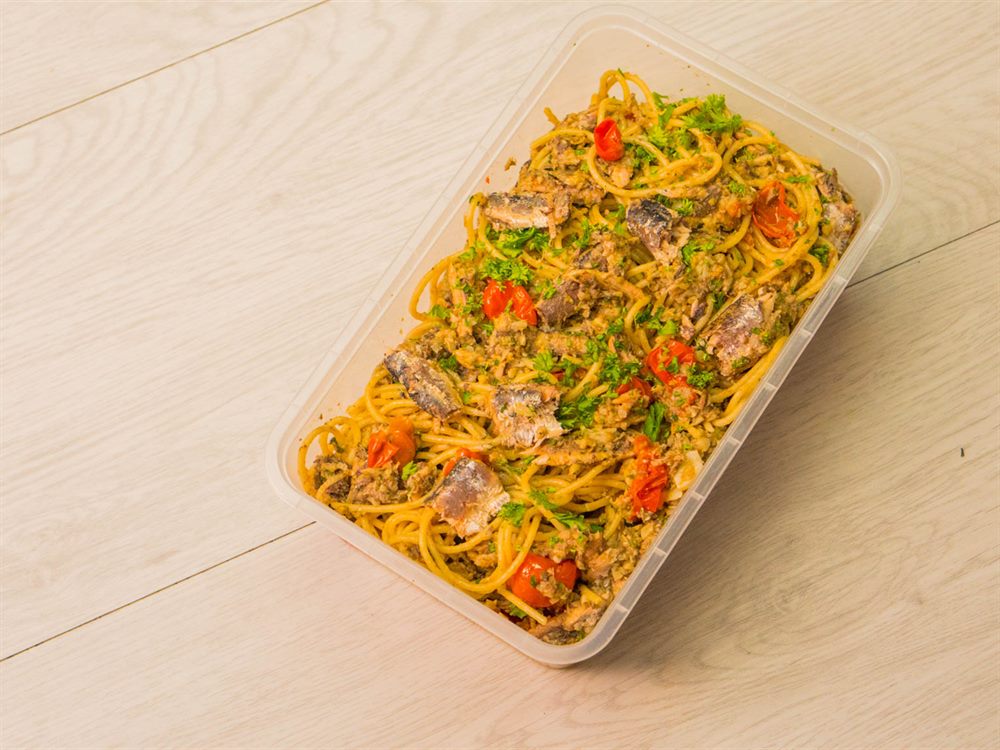 Sardine pasta batched in a food service tub, shot from above, a menu application for Ligo Sardines